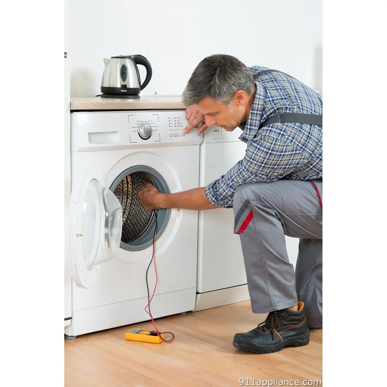 Washer repair technician testing appliance