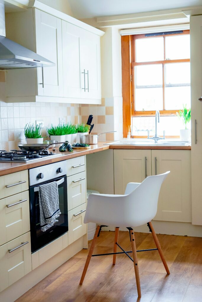 A white chair in a kitchen.