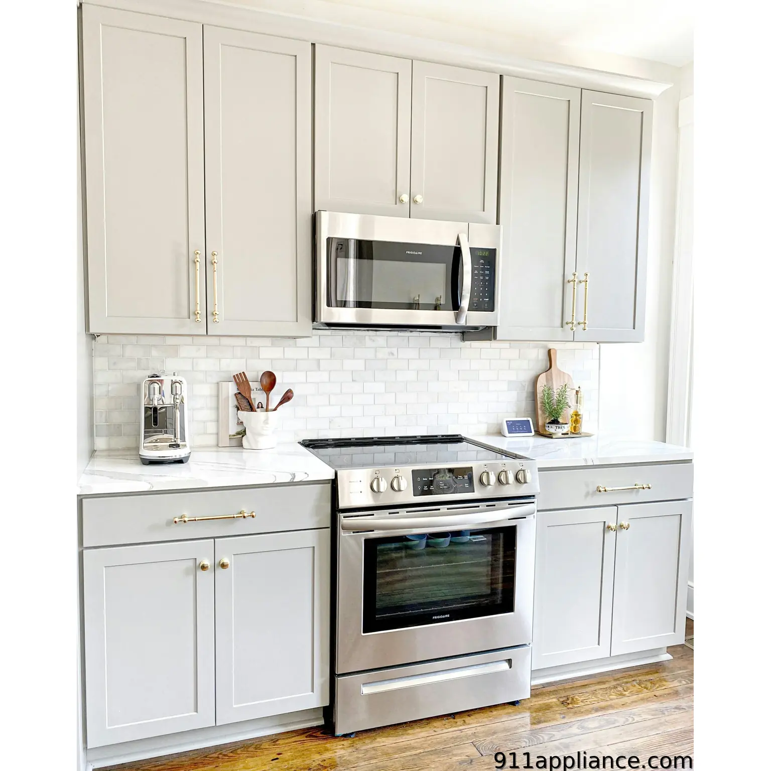 Modern gray kitchen with stainless steel appliances