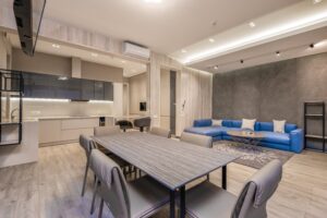A living room and dining room in a modern apartment.