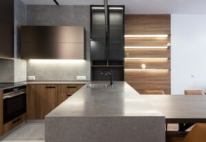 A modern kitchen with wooden cabinets and counter tops.
