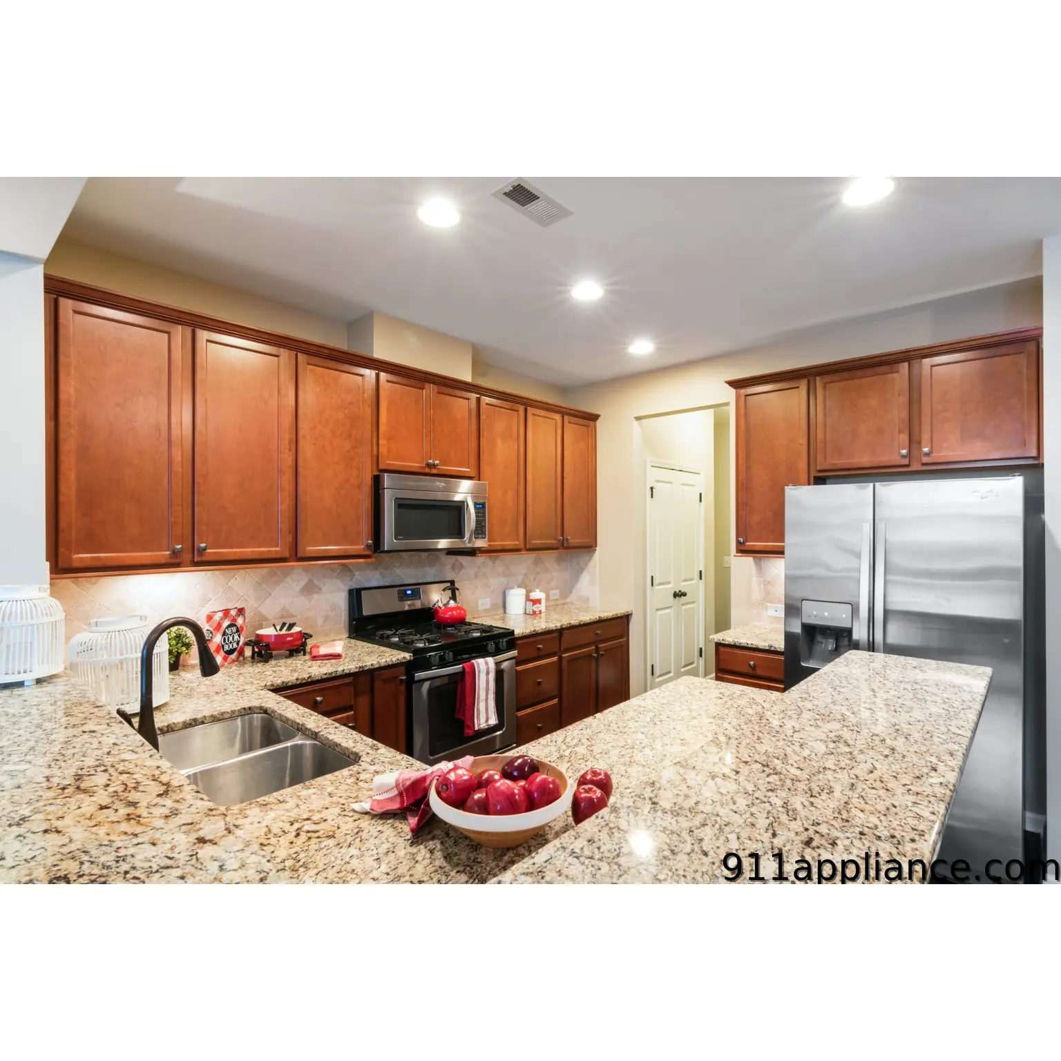 Modern granite kitchen with cherry cabinets