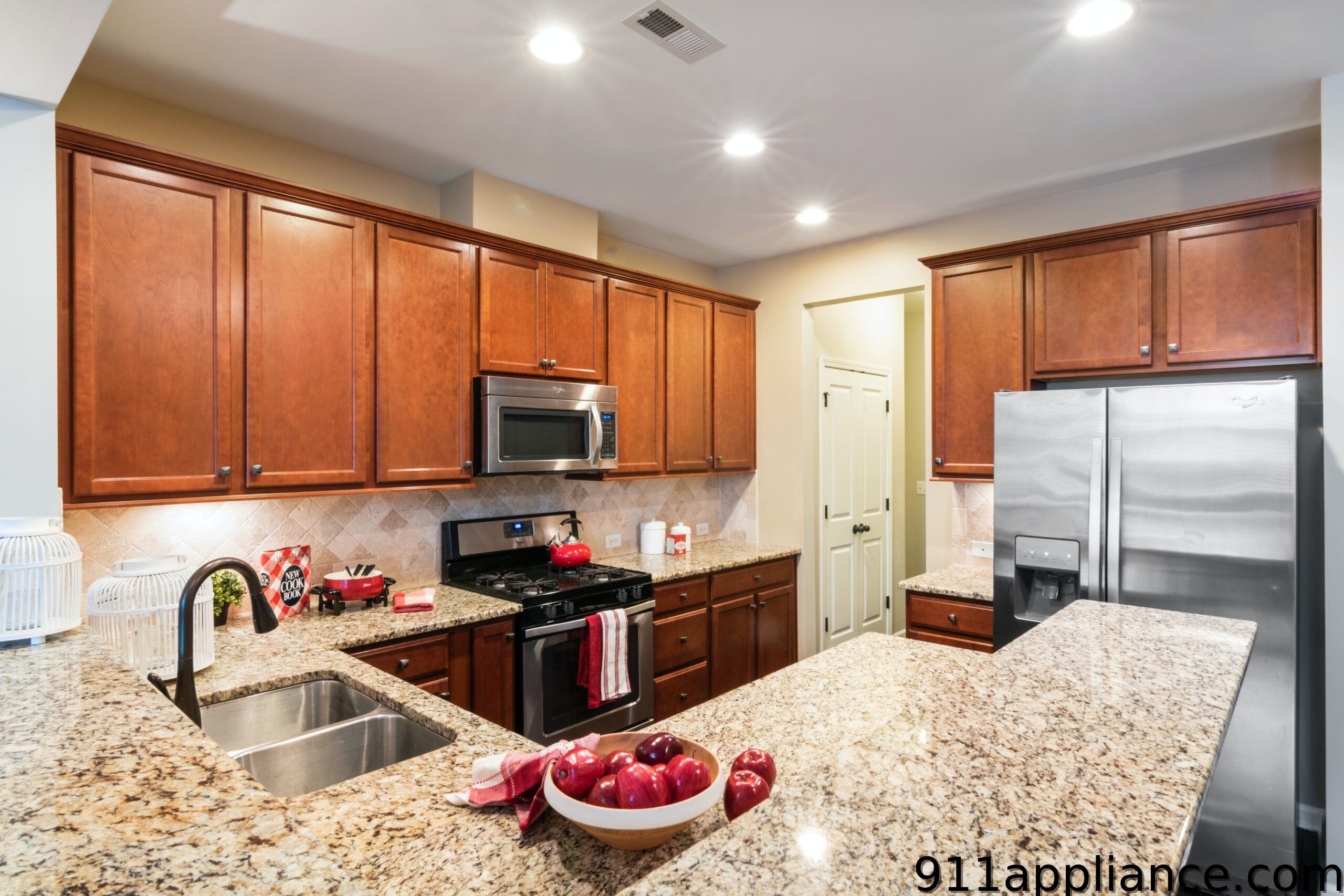 Modern granite kitchen with cherry cabinets