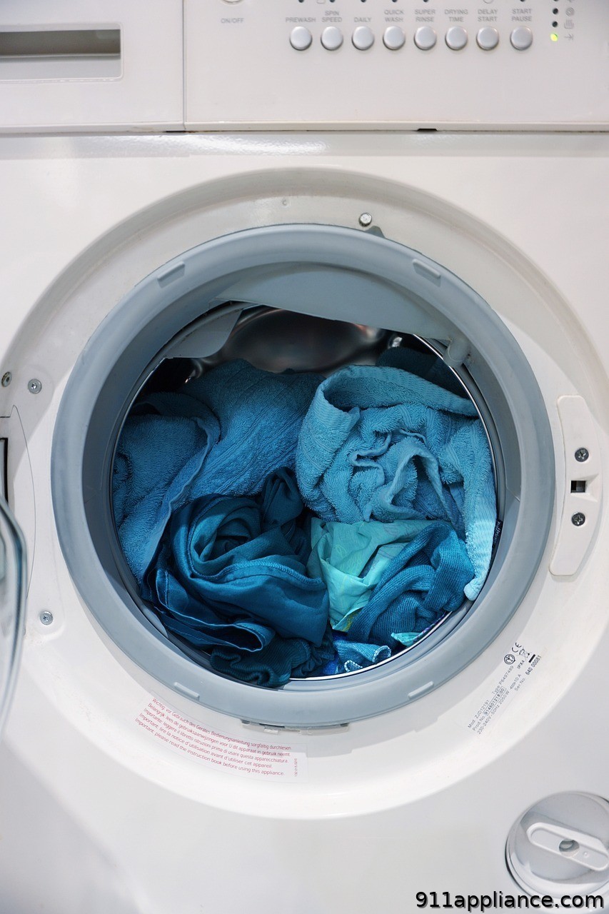 Washing machine with blue clothes