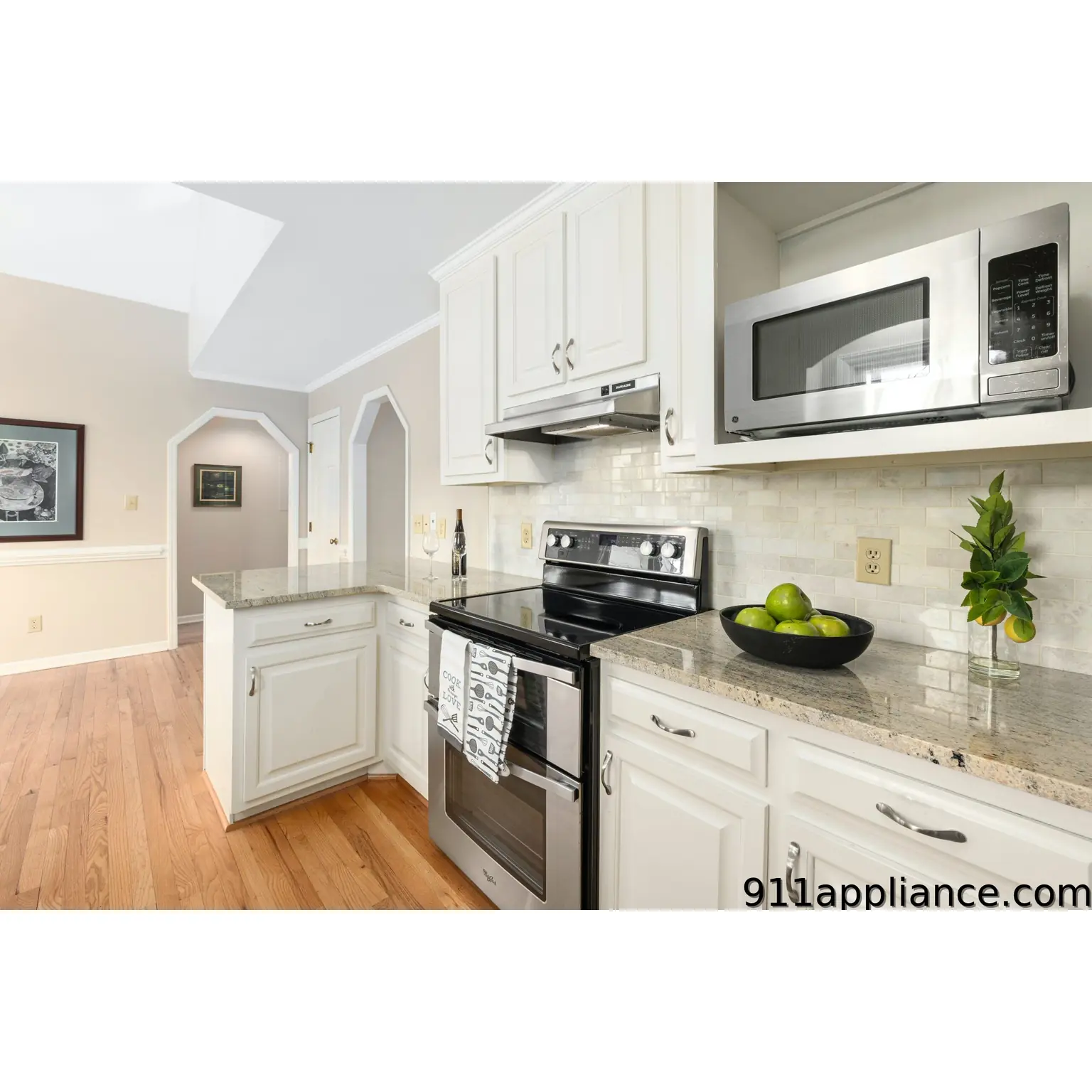White kitchen with stainless appliances