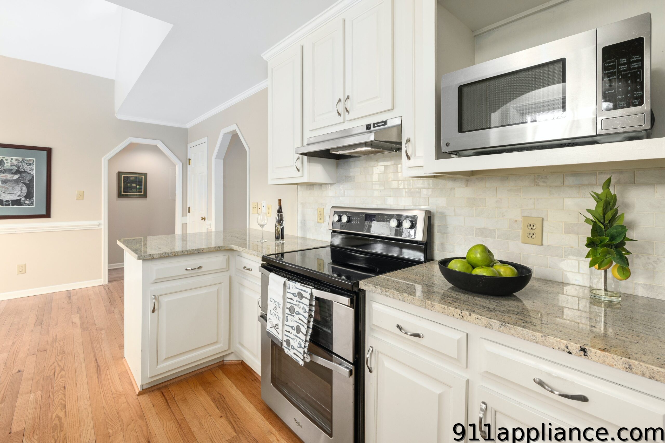 White kitchen with stainless appliances