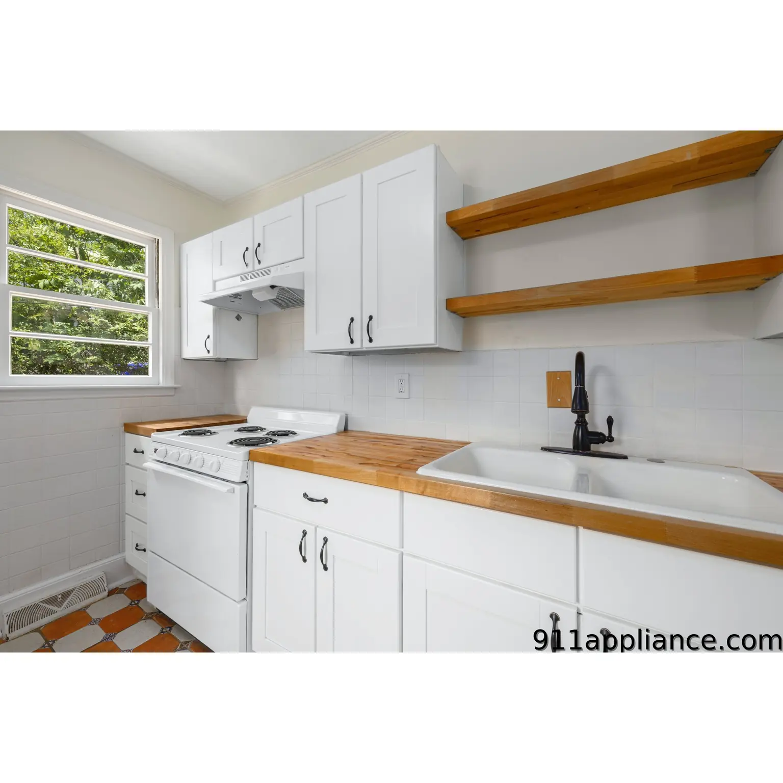 White kitchen with wooden counters