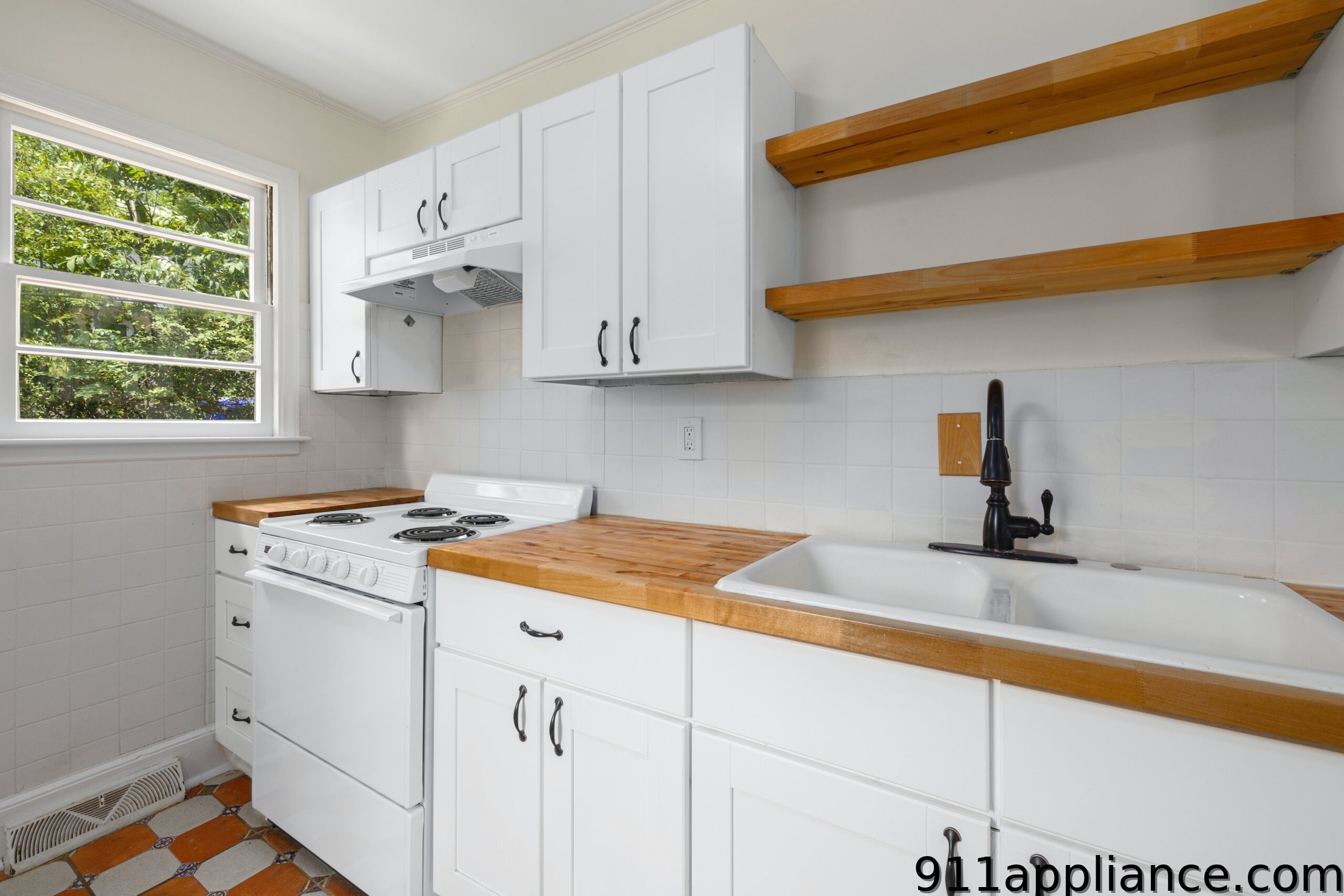White kitchen with wooden counters