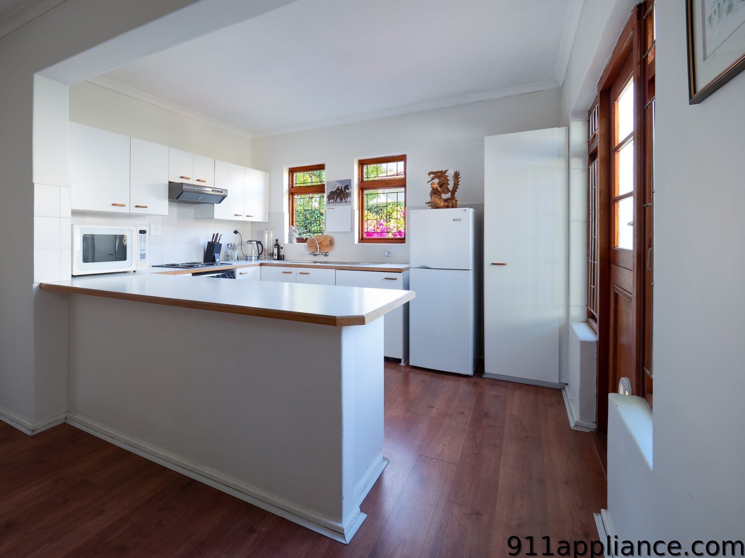 White kitchen with island