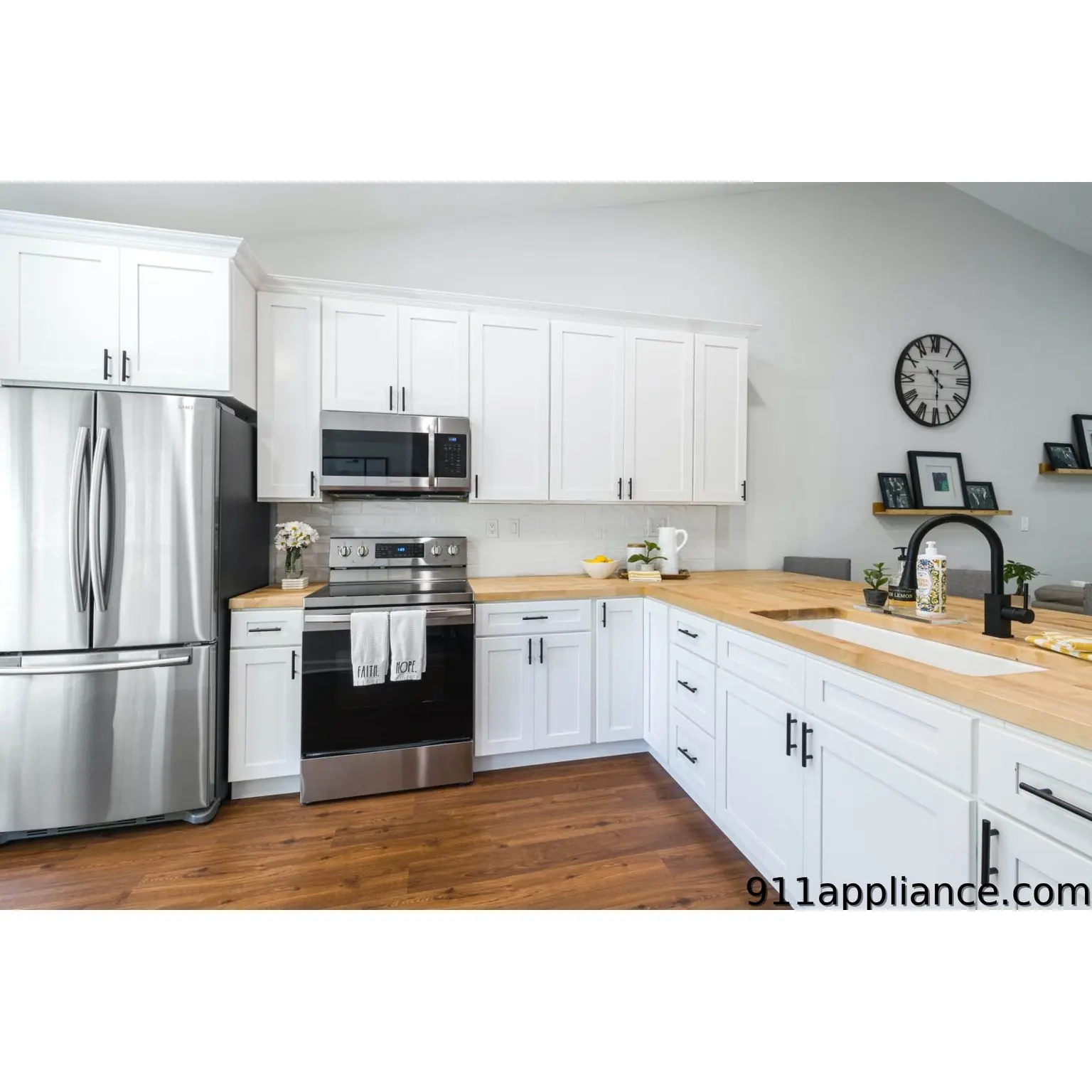 Modern white kitchen with appliances