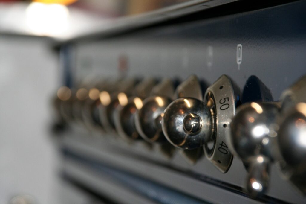 a close up of the knobs on a stove.