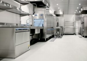 a commercial kitchen with stainless steel appliances.