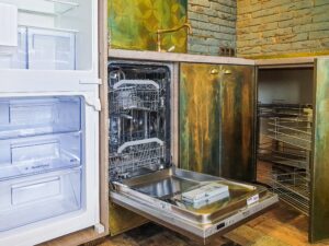 a kitchen with a dishwasher and a refrigerator.
