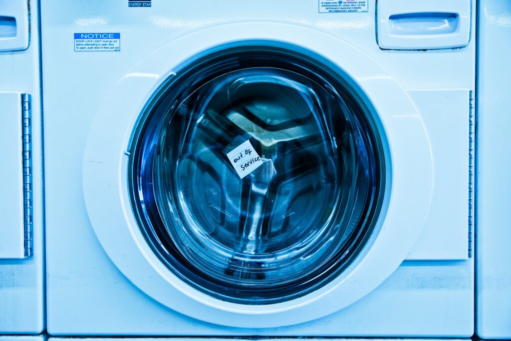 a picture of a washing machine in a laundry room.