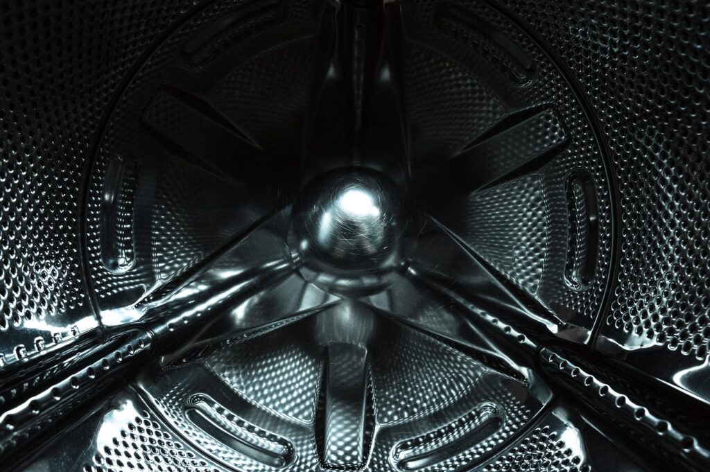 a close up of the inside of a washing machine.