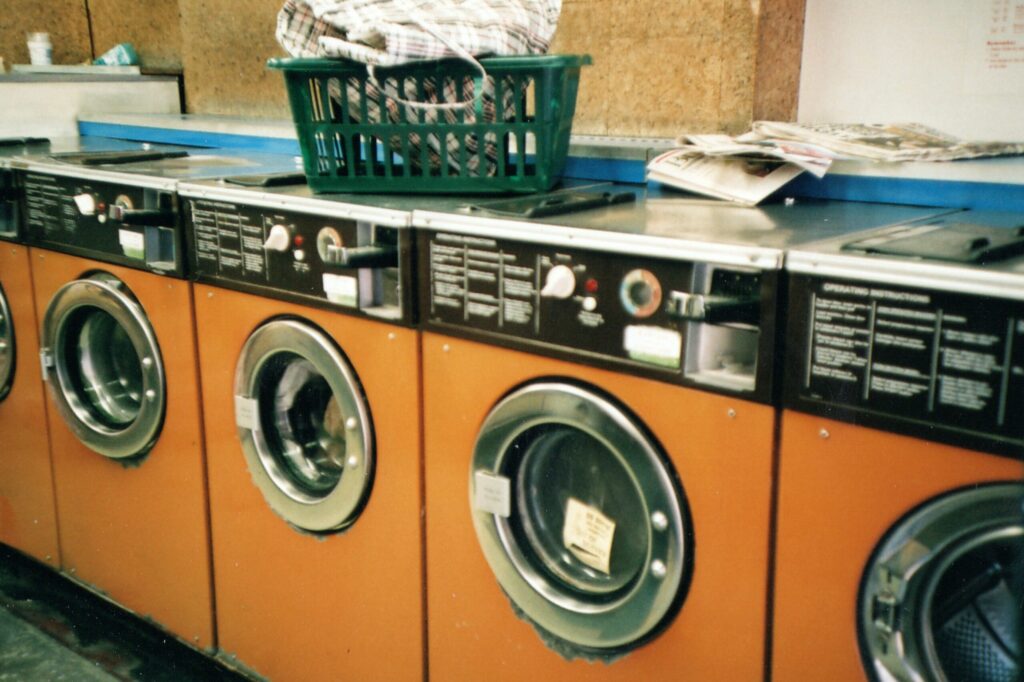 Row of orange washing machines