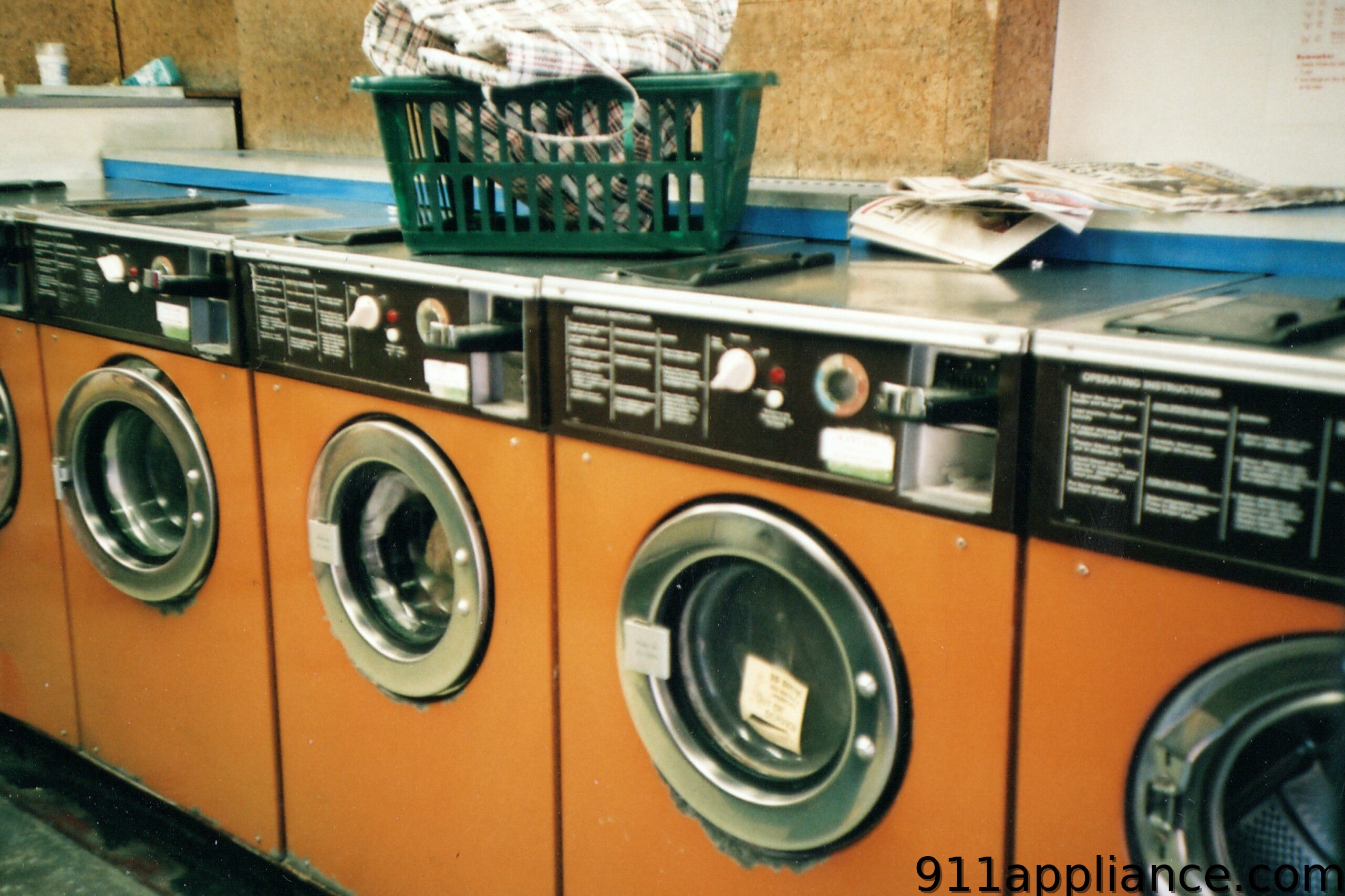 Row of orange washing machines