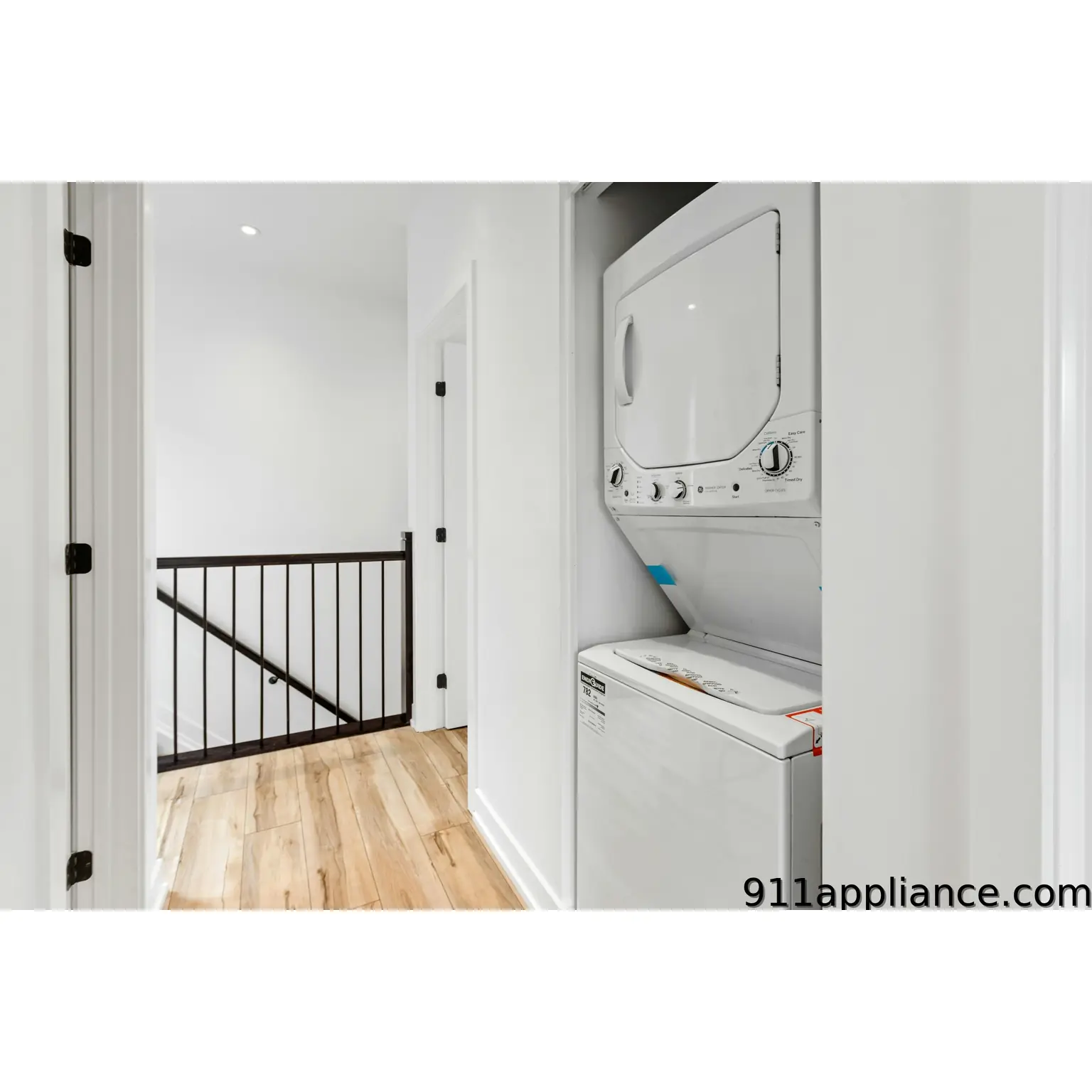 Stacked white washer dryer closet