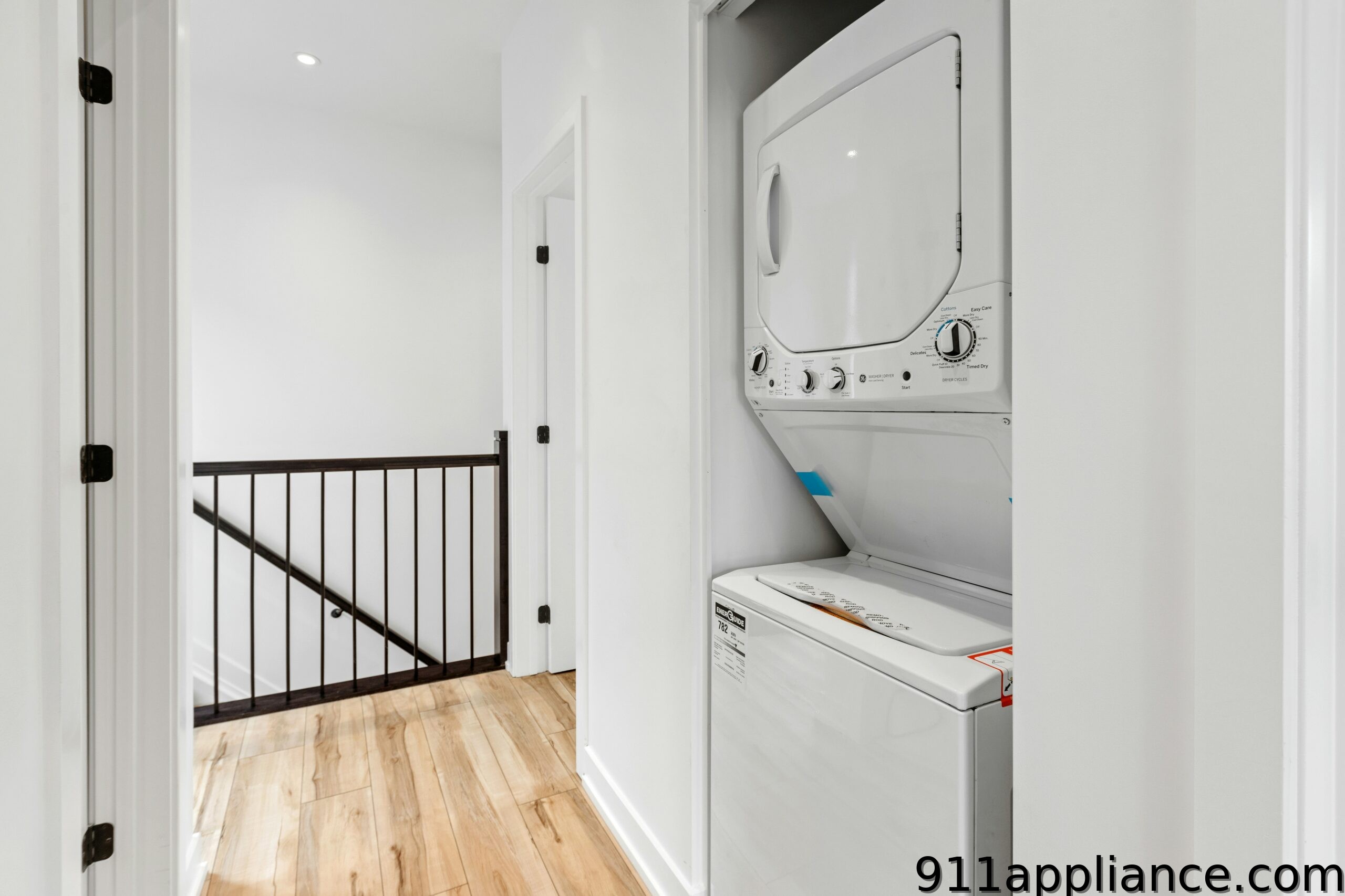Stacked white washer dryer closet