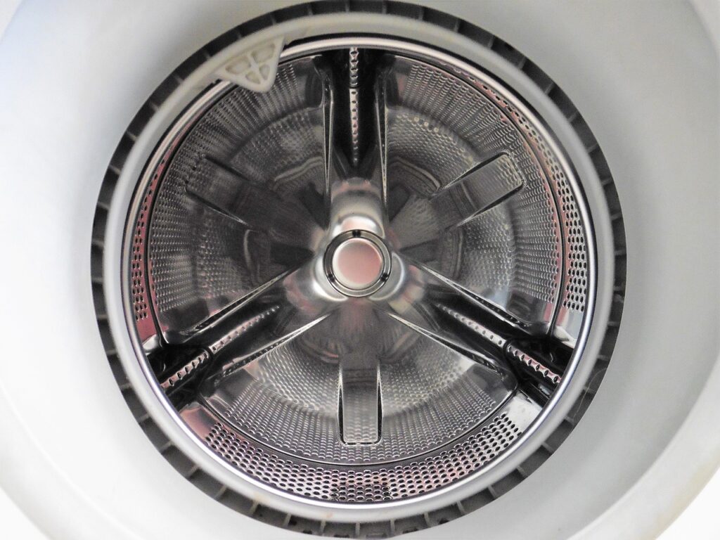 A close up of the wheel of a washing machine.
