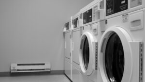 A black and white photo of a laundry room.
