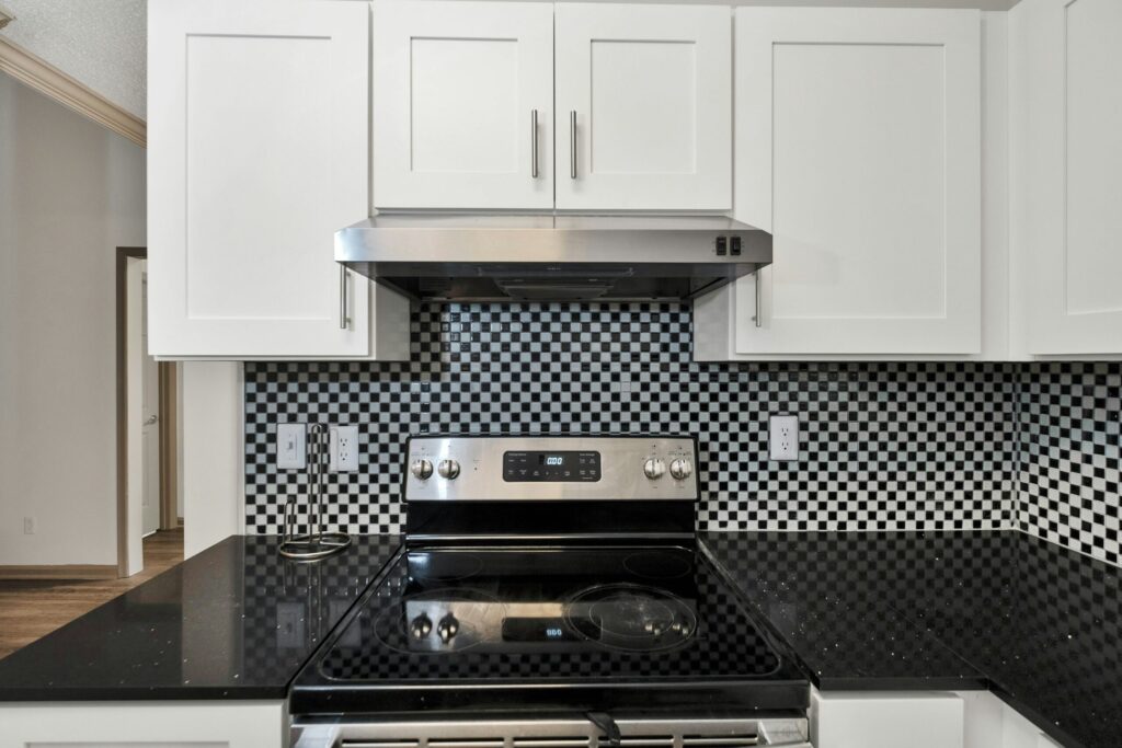 Modern kitchen with black backsplash