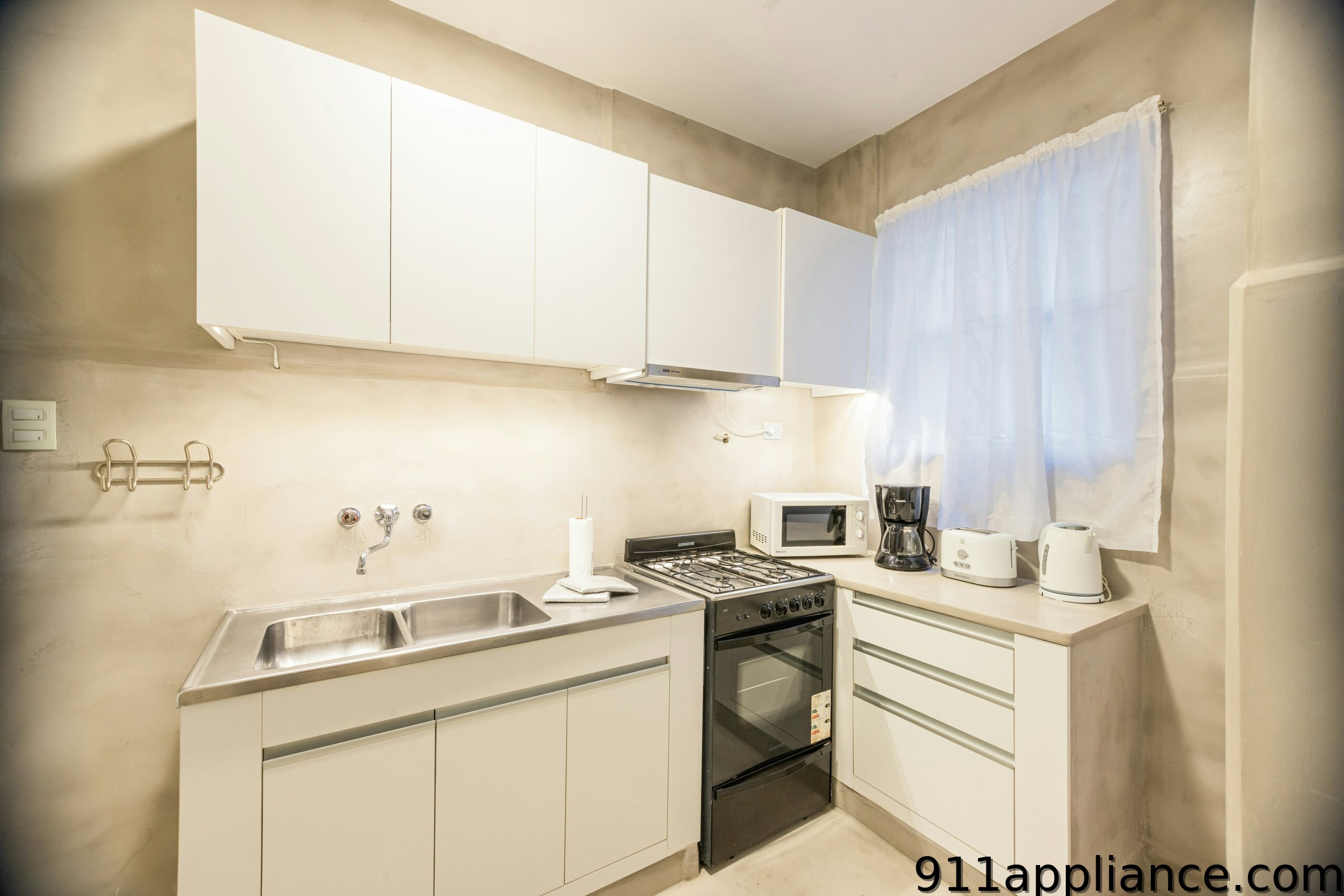 Modern kitchen with white cabinets
