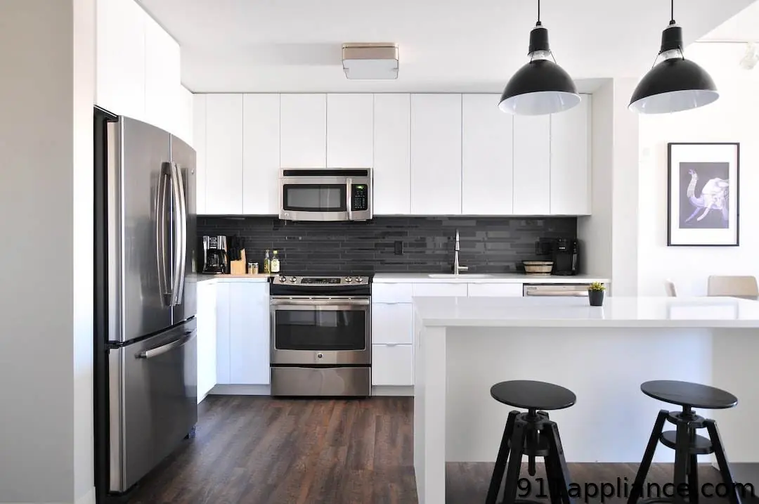 Modern kitchen with stainless steel appliances.