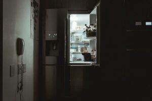 Open refrigerator at night