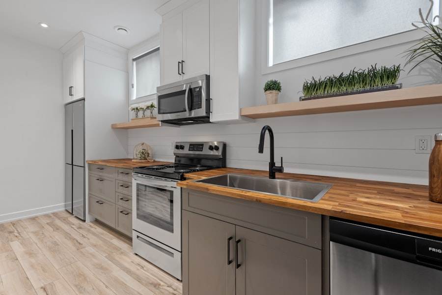 A kitchen with wood counter tops and stainless steel appliances.