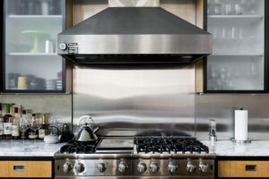 a kitchen with a stainless steel range hood.