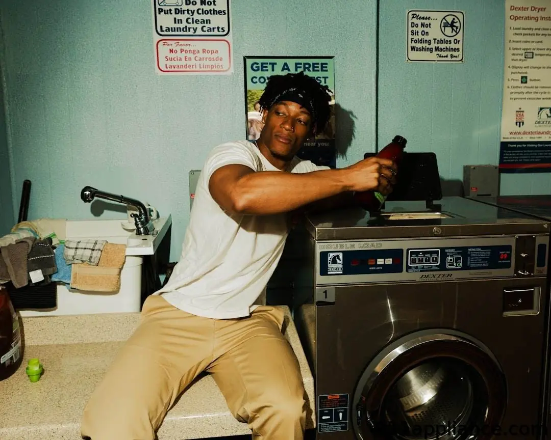 Man in laundry room.