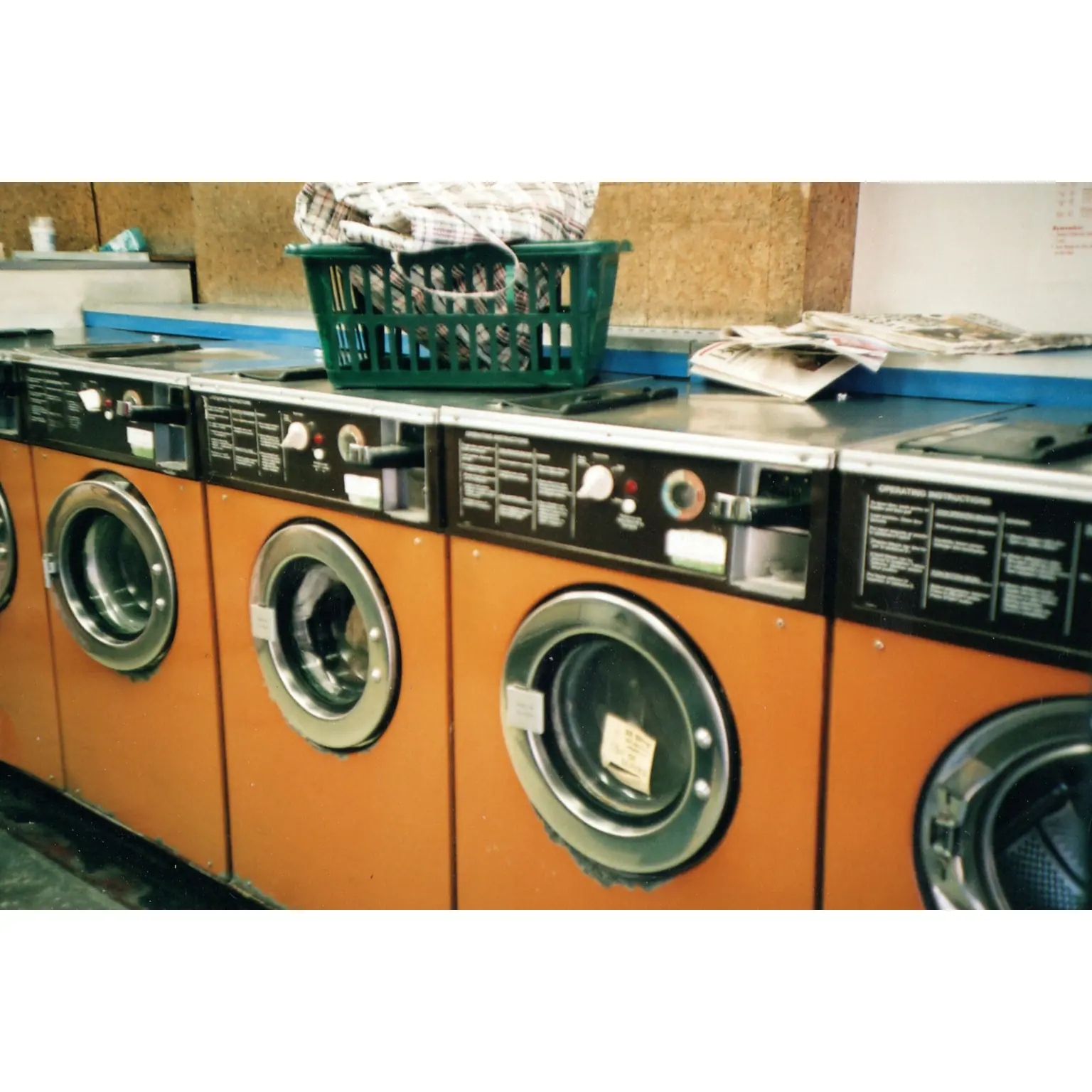 Orange washing machines in a row